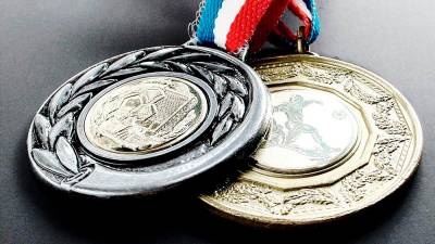 Medallas olímpicas del piragüista David Cal, que fue imagen de Rianxeira. Foto: Jealsa